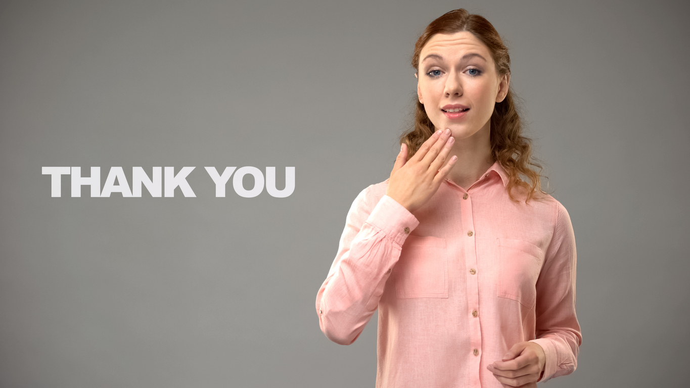 Woman using American Sign Language to say Thank You
